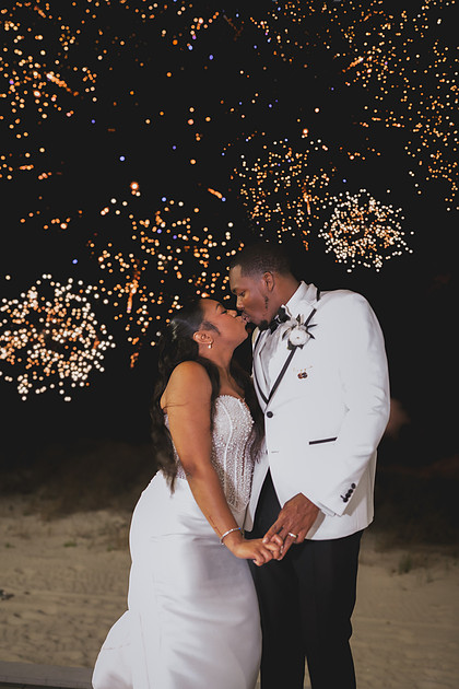 Luxury bride and groom portrait with a Fireworks send off.