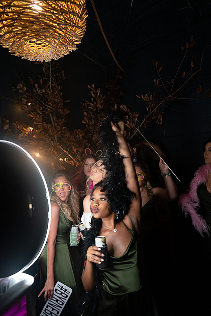 Guests having fun inside Grayfish Photography Photo Booth